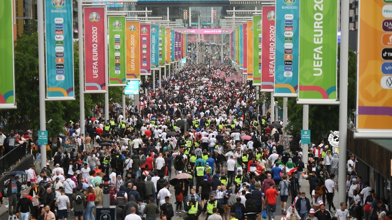 Fans walk up towards Wembley Stadium