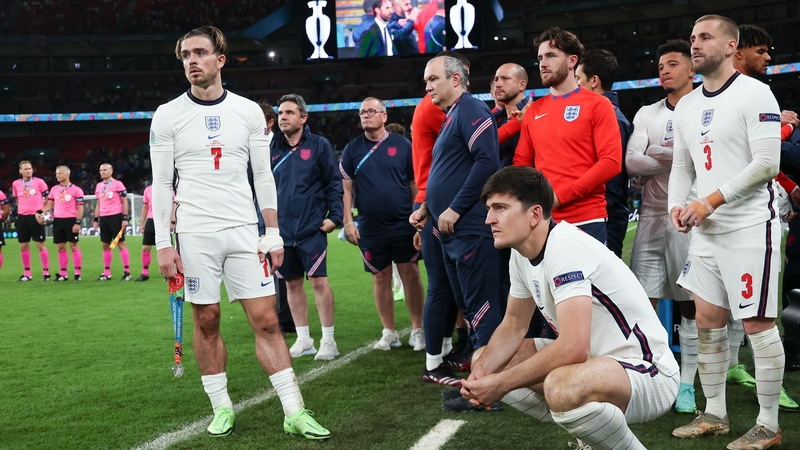 Grealish (L) watches on during the penalty shootout