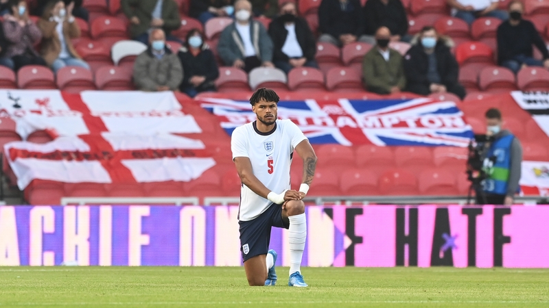 Tyrone Mings takes the knee ahead of England's pre-tournament game with Austria