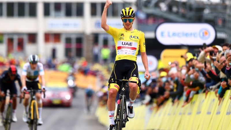 Tadej Pogacar crosses the line first