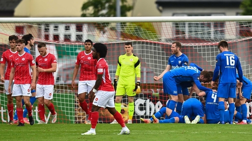 FH Hafnarfjordur's Steven Lennon (hidden) celebrates with team-mates after scoring his side's first goal