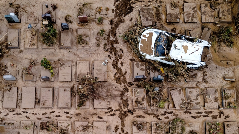 An aerial view taken with a drone shows a damaged car at a cemetery in Bad Neuenahr-Ahrweiler, Germany