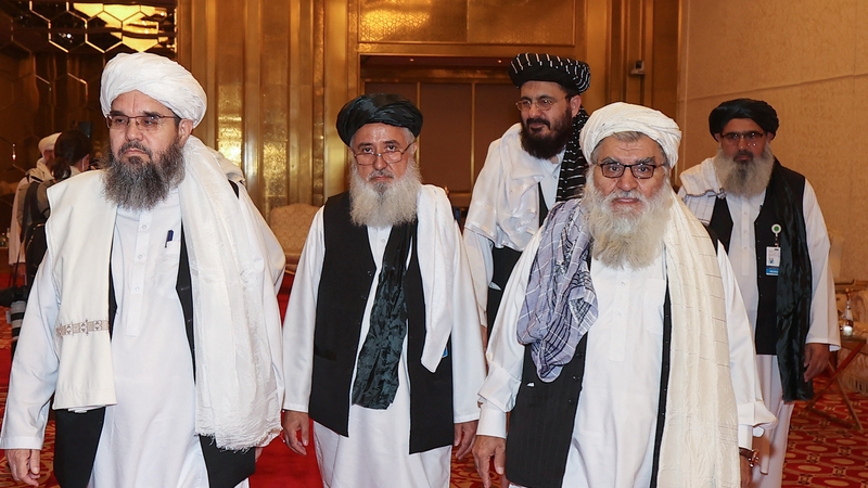 A delgation of Afghanistan's Taliban movement attends a session of the peace talks between the Afghan government and the Taliban in the Qatari capital Doha