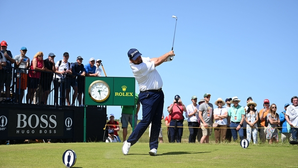 Shane Lowry hit two late birdies to keep him in with an outside chance of competing for the Claret Jug