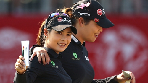 Moriya Jutanugarn (L) and Ariya Jutanugarn celebrate their win