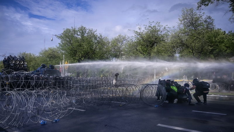 Police fire water cannon at protesters in Bangkok