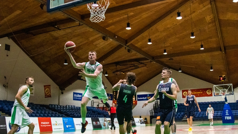 John Carroll drives for the basket at the National Basketball Arena