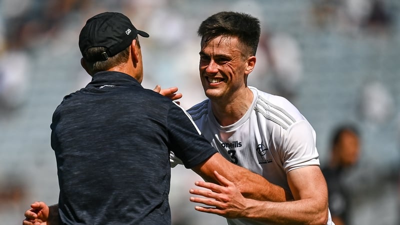 Jack O'Connor embraces Mick O'Grady at the final whistle