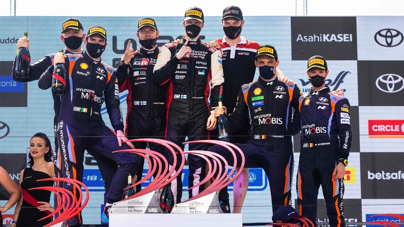 Craig Breen and co-driver Paul Nagle on the left of the podium after the race