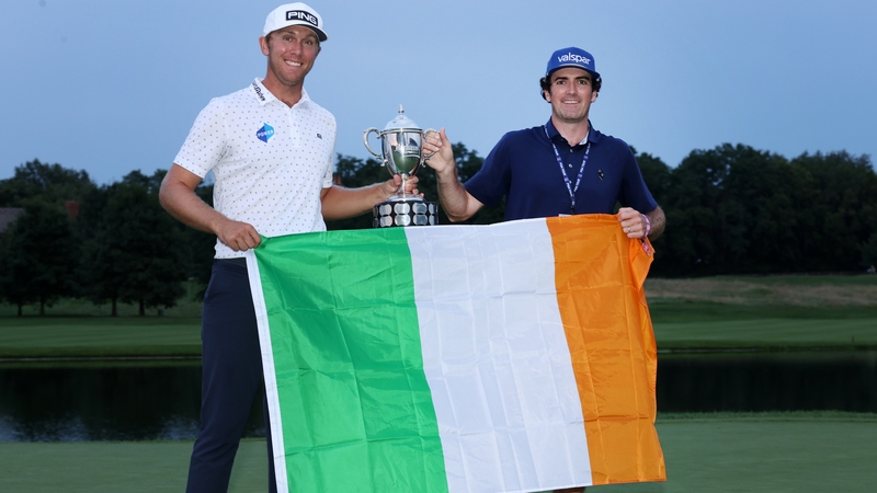 Seamus Power poses with the trophy and his caddie Simon Keelan