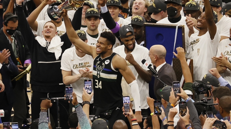 Giannis Antetokounmpo with the MVP trophy