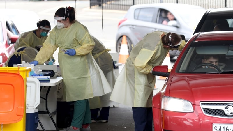 Health workers at a pop up Covid-19 testing site at Waterworld in Adelaide