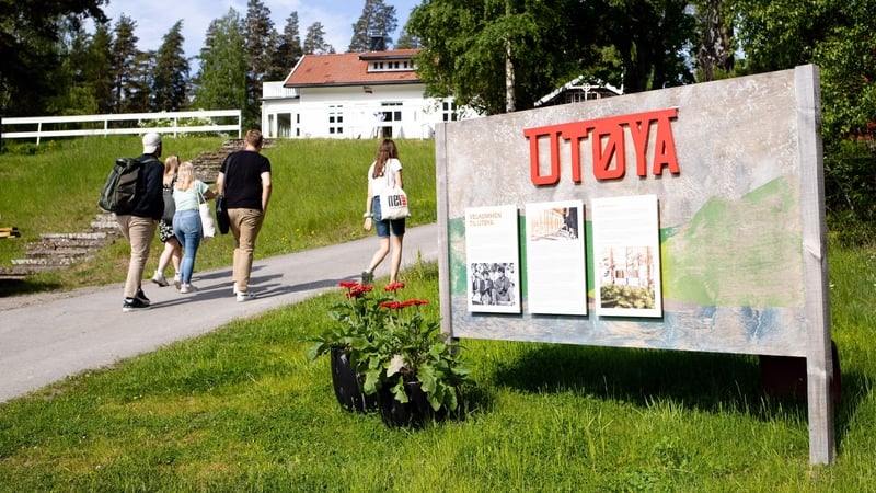 People walk on Utoya where far-right extremist Anders Behring Breivik killed 69 of his 77 victims in 2011