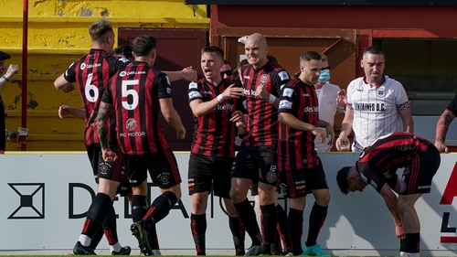Ross Tierney is mobbed after his goal