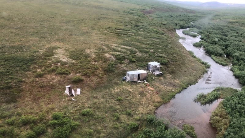 Aircraft crew spotted an 'SOS' sign on top of a shack (Pic: US Coast Guard)