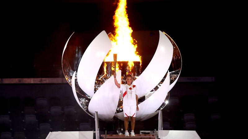 Naomi Osaka lights the Olympic cauldron with the Olympic torch