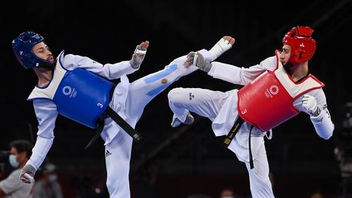 Jack Woolley, in red, up against Lucas Guzman