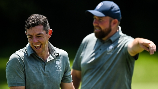 Rory McIlroy (L) and Shane Lowry are well placed in tied 7th after 36 holes