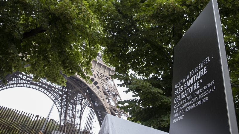 A sign in Paris indicates that a health pass is required to access the Eiffel Tower