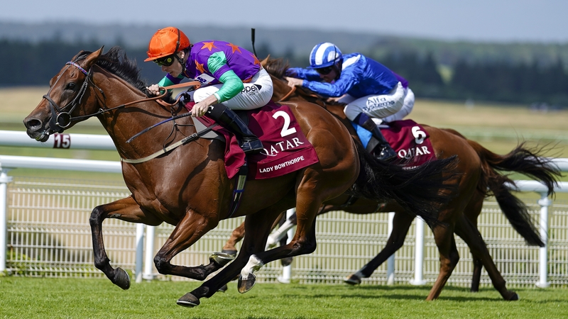 Kieran Shoemark (in the orange cap) steers Lady Bowthorpe to the Qatar Nassau Stakes at Goodwood