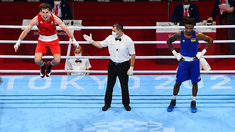 Aidan Walsh celebrates winning bronze at least in welterweight boxing