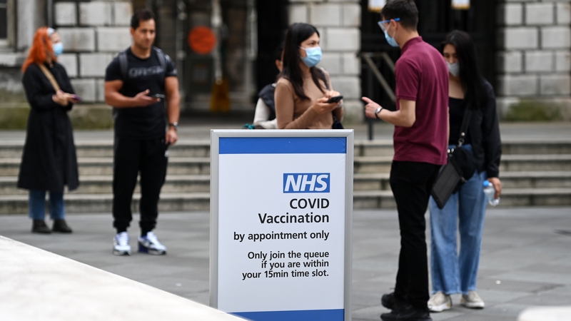 People queue up at a Covid-19 vaccination centre in London