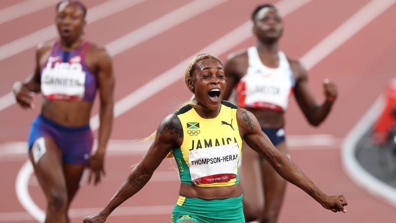Elaine Thompson-Herah celebrates victory in the women's 100m final
