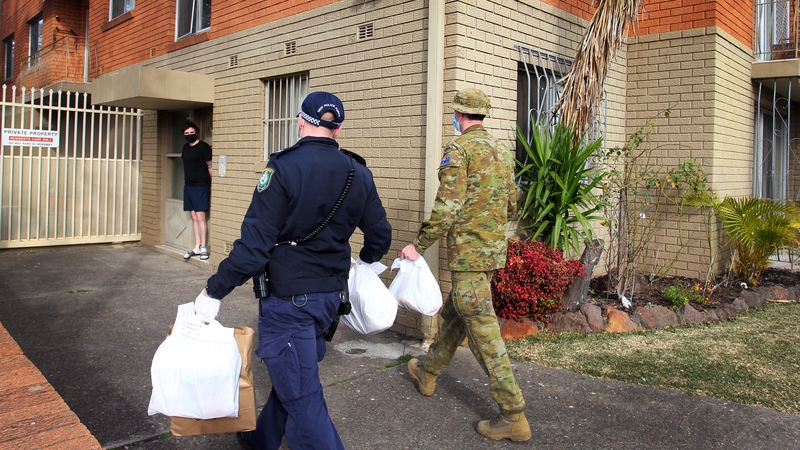 Australian Defence Force personnel and NSW police deliver food packages to those people in lockdown in Sydney