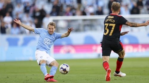 Oscar Lewicki (L) of Malmo and Rangers' Scott Arfield
