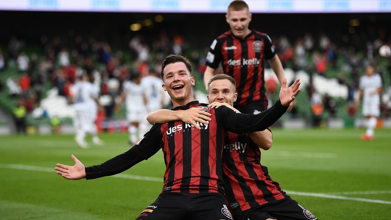 Ali Coote celebrates with Liam Burt after opening the scoring