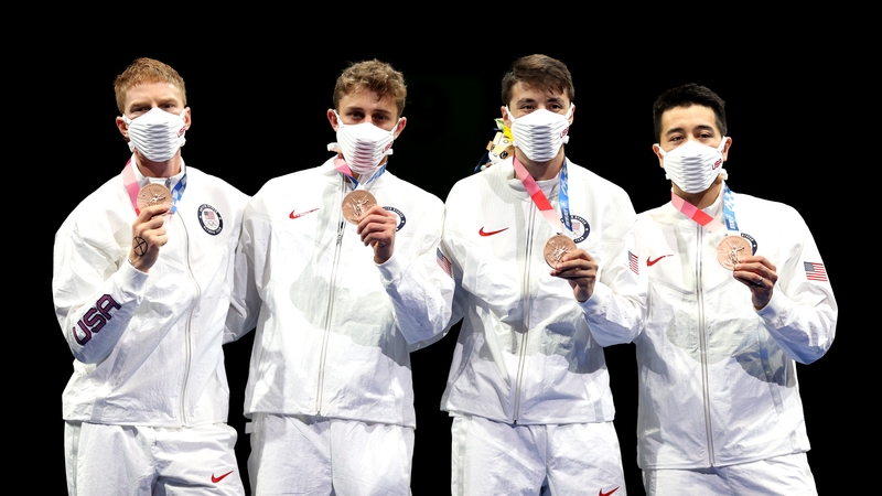 US fencer Race Imboden (left) drew an X on the back of his hand