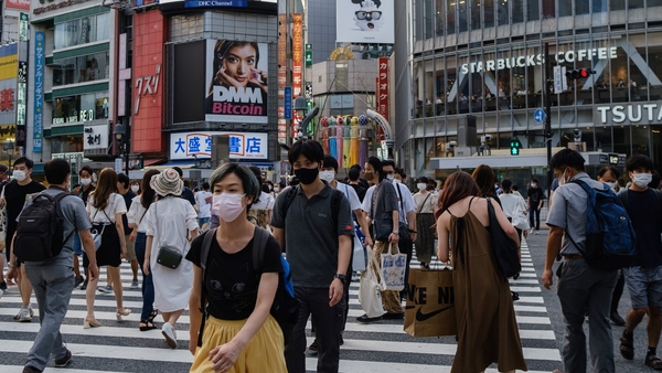 Global supply disruptions hit exports and business spending plans and new Covid cases soured Japanese consumers' mood
