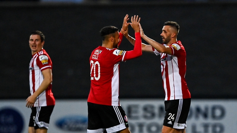 Daniel Lafferty of Derry City, right, celebrates with team-mate Darren Cole aftre scoring his side's third goal