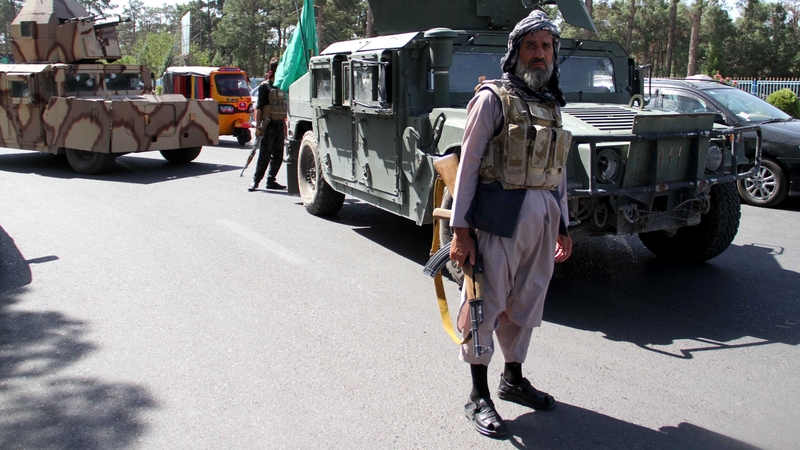 Afghan security officials in Herat after taking back control of parts of the city from the Taliban today