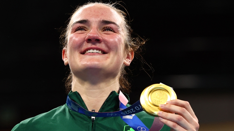 Kellie Harrington celebrates on the podium during the victory ceremony