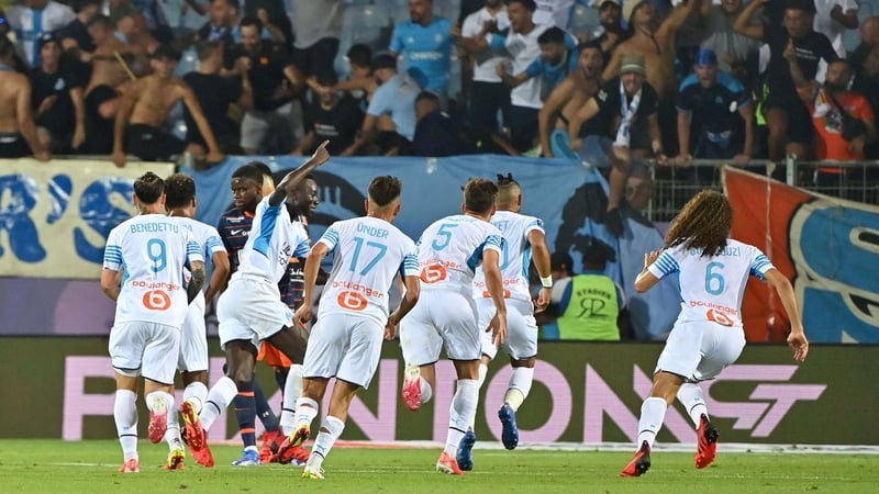 Marseille's players react after ex-West Ham playmaker Dimitri Payet found the net