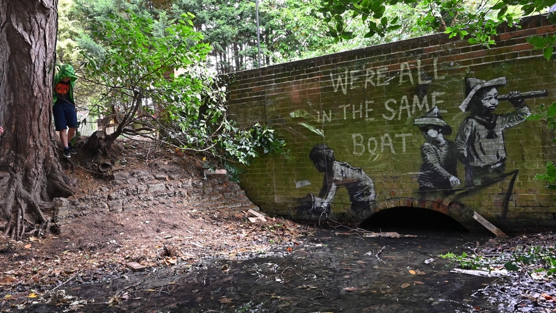 Writing above the artwork says 'We're all in the same boat'