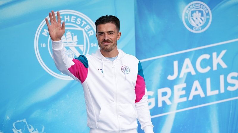Jack Grealish acknowledges fans outside the Etihad Stadium