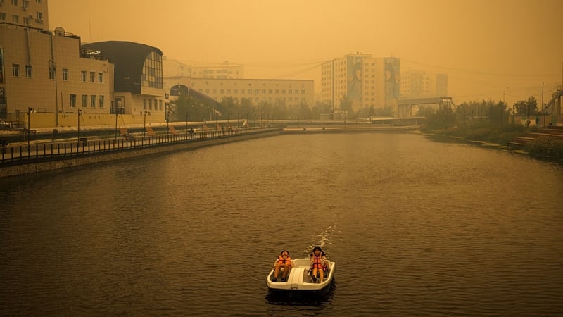 Smoke from nearby forest fires hangs over the city of Yakutsk