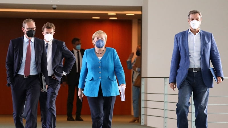German Chancellor Angela Merkel, Bavarian State Premier Markus Soeder (right), and Berlin Mayor Michael Mueller (left) held a press conference after a meeting with the heads of government of Germany's federal states, pic: Getty