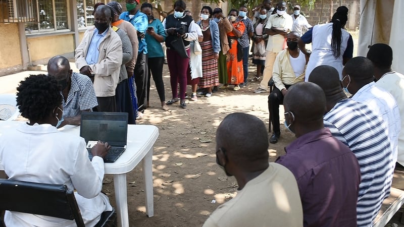 Residents in Nairobi, Kenya, wait in line to register in order to receive their first dose of the AstraZeneca Covid-19 vaccine