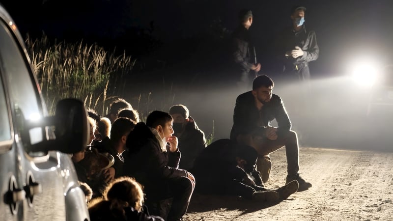 A group of migrants are detained at the border between Belarus and Latvia