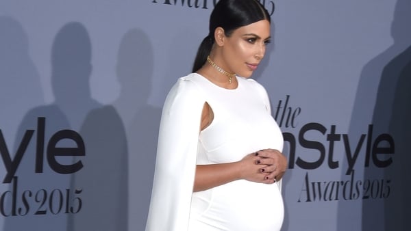 Kim Kardashian West (pictured at the InStyle Awards in Los Angeles in October 2015) - "I would sit at home and cry all the time"