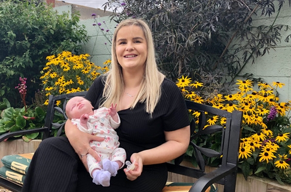Laura Curtis and four-week-old baby daughter Demi
