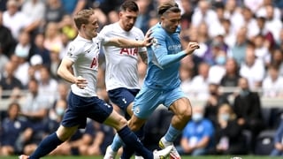 Jack Grealish is tracked by Spurs' Oliver Skipp