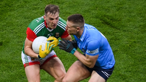 John Small collides with Eoghan McLaughlin
