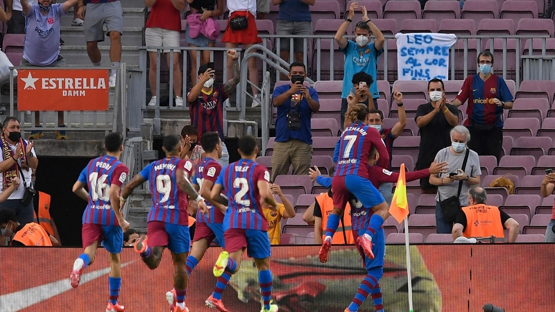 Gerard Pique is mobbed after his goal
