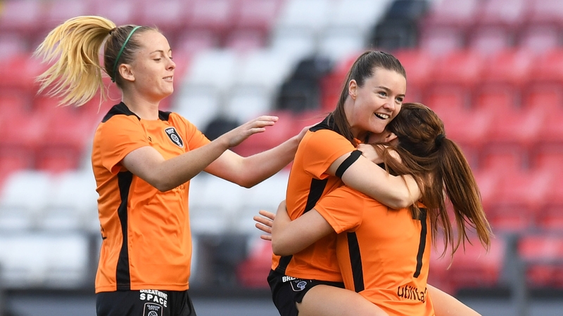 Clare Shine (centre) celebrates her opener