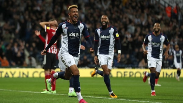 Callum Robinson celebrates after scoring the fourth