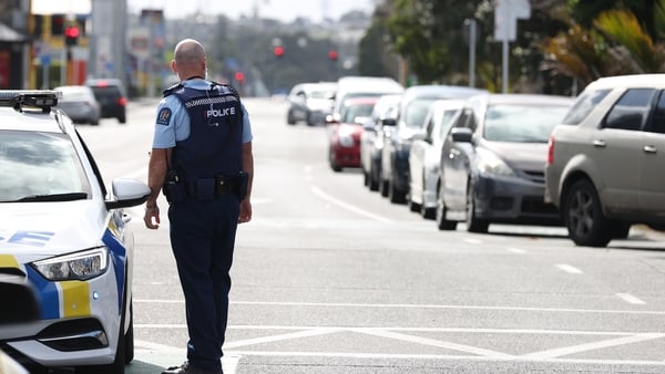 Police direct queues of people waiting for Covid-19 testing in Auckland, New Zealand